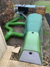 The green Eglu Go rabbit hutch with Zippi tunnel and playpen