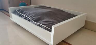 The platform helps raise the dog bed.