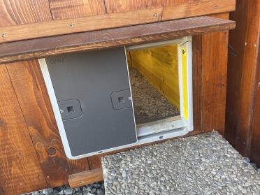 Attaching the Omlet automatic door opener attached to a wooden coop.
