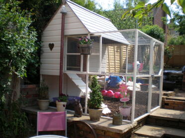 My lovely chicken house - although this now has pink gingham curtains in the door =)