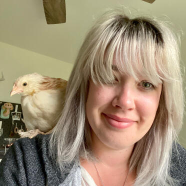 Emmy Lou, the chicken, perching on my shoulder!