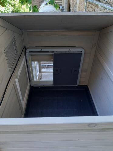 Inside Wooden Chicken Coop with Omlet Grey Automatic Chicken Coop Door