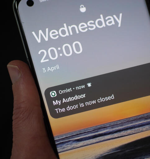 Smart Autodoor app notification on a phone screen