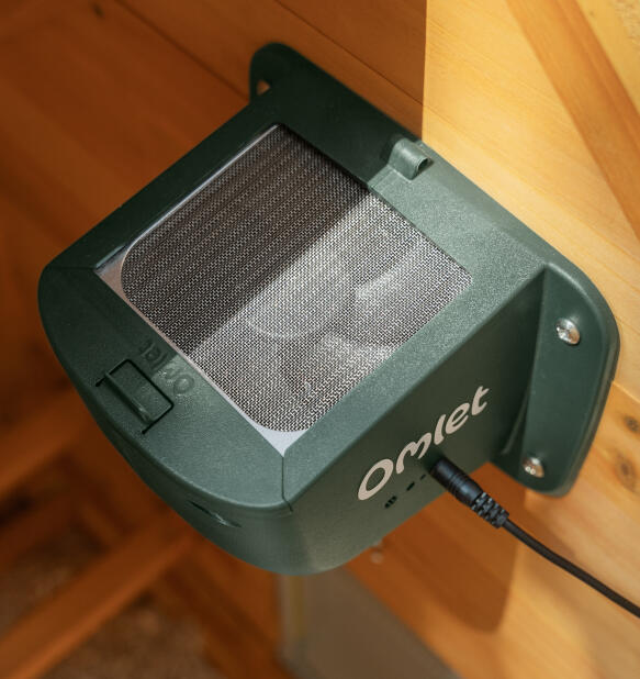 Omlet smart fan mounted inside a wooden coop