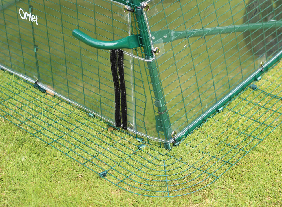 Siply undo the velcro on the Cube Windbreak to use the footpedals.
