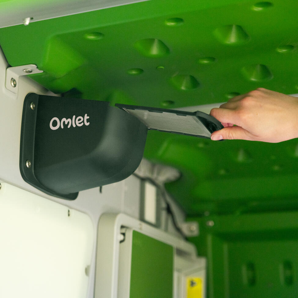 A close up of the Omlet smart fan attached to the inside of the Eglu pro chicken coop