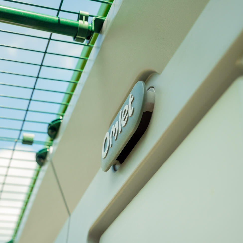 A close up of the Omlet smart fan attached to the inside of the Eglu pro chicken coop